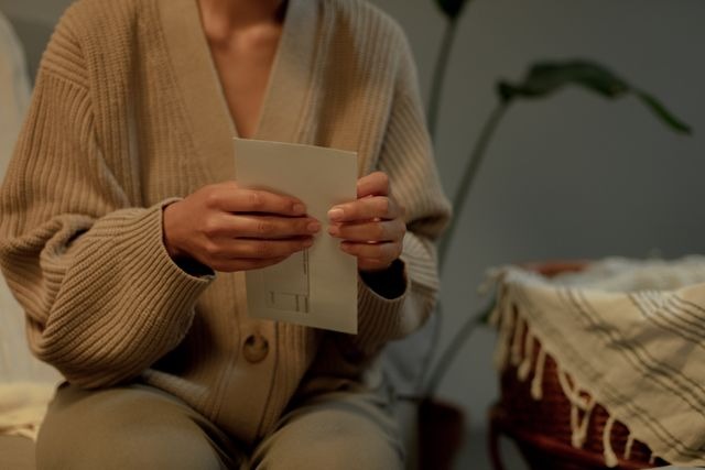 a person opening an envelope