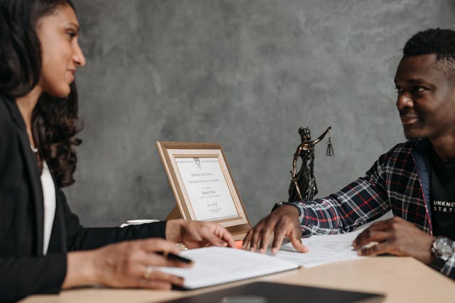 a lawyer speaking with a client