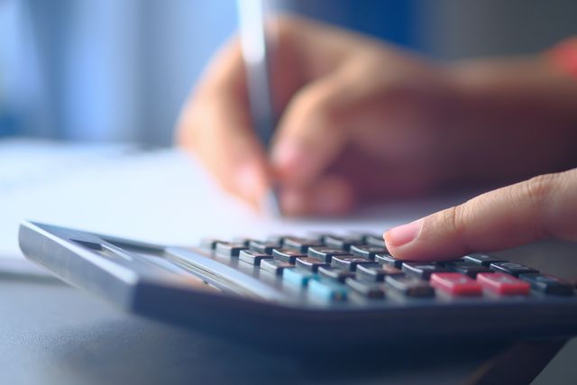 a person using a calculator