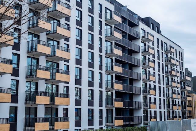 the exterior of a large, modern apartment building