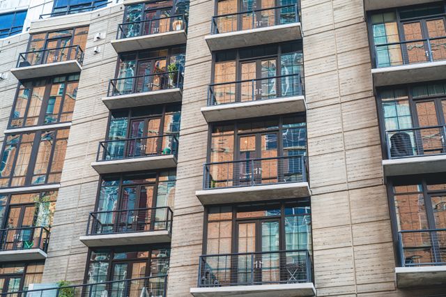 the exterior of an apartment building with balconies